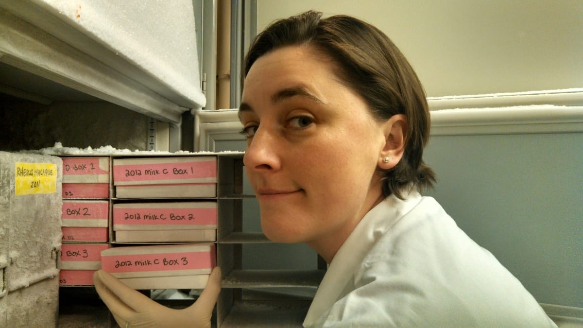 photo of Hinde pulling frozen milk samples out of a freezer