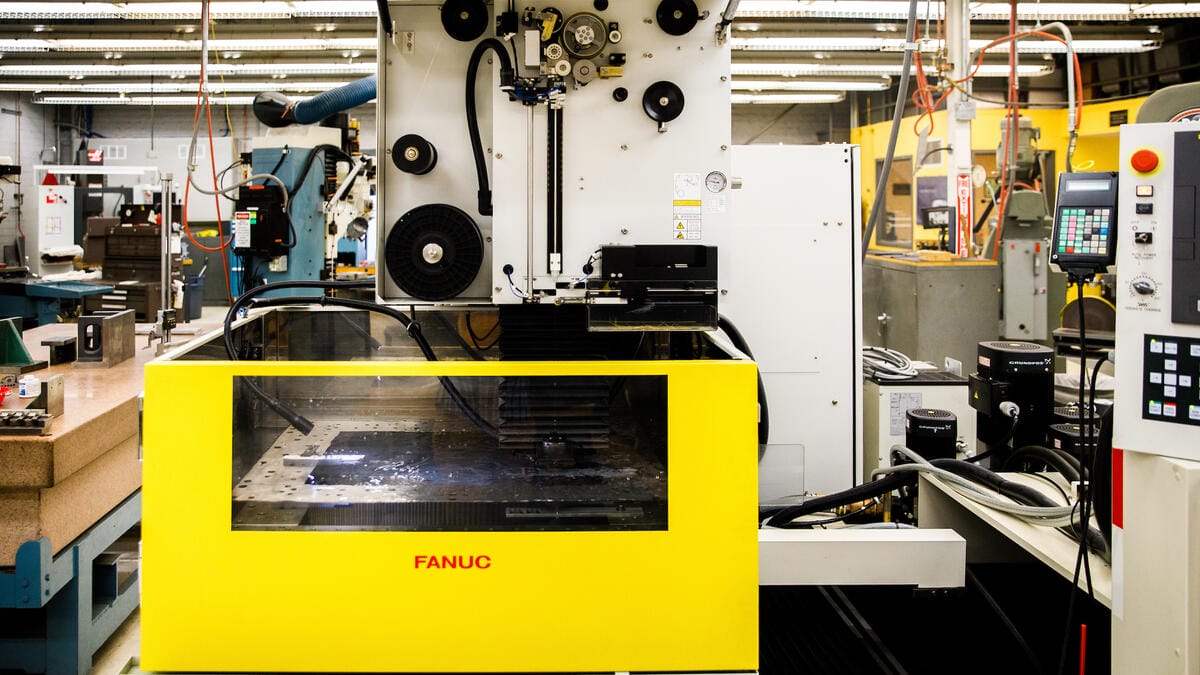 A yellow machine in the Instrument Design and Fabrication Core Facility